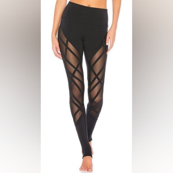 Alo Yoga High-Waist Wrapped Stirrup Legging in black with mesh panels. - Picture 5 of 7